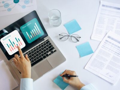 Young woman at office using laptop