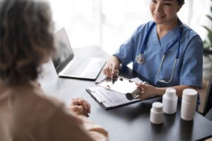 Caregiver consulting with elderly patiernt