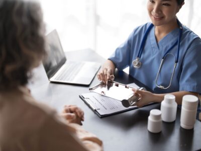 Caregiver consulting with elderly patiernt
