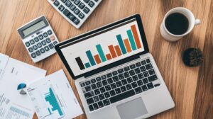 An overhead shot of a desk with a laptop